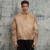 Tan sun-faded puffer jacket with sleeve patch detail