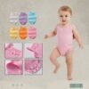 Baby standing in a pink sleeveless onesie with close-up details