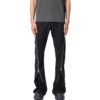 Man wearing slim black zipper-panel pants