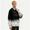 Man wearing a spray-wash collared pullover with 'RAINBOW BLEACH TOUCH' graphic