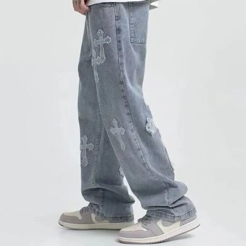 Light-wash wide-leg jeans with cross embellishments