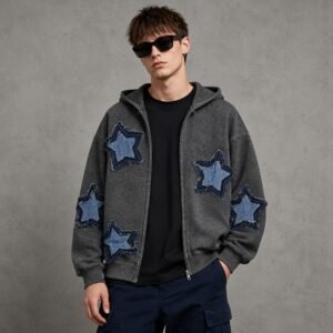 Man wearing a charcoal grey zip hoodie with star appliques