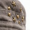 Custom Vintage Washed Studded Flat Cap - Style FD04D0 Close-up of a vintage washed grey flat cap with metal star and pyramid studs.