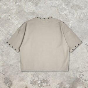 Beige oversized streetwear t-shirt with stud details on collar and sleeves