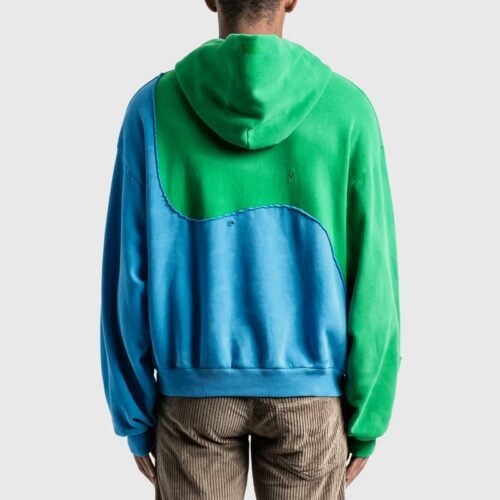 Back view of a blue and green swirl color-block hoodie with distressed details
