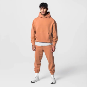 Man wearing an orange thickened pullover hoodie and jogger set