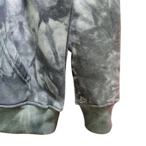Close-up of a grey tie-dye pullover hoodie sleeve and pocket.