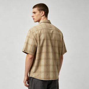 Man wearing a vintage tan plaid short-sleeve shirt