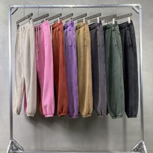 Assorted vintage wash fleece jogger sweatpants hanging on a rack