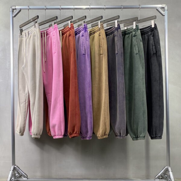 Assorted vintage wash fleece jogger sweatpants hanging on a rack