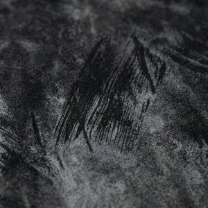 Close-up of a dark grey vintage-washed oversized heavyweight t-shirt with abstract print.