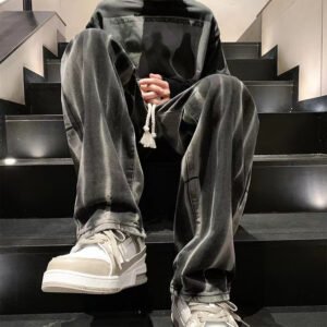 Man wearing vintage wash loose straight leg jeans
