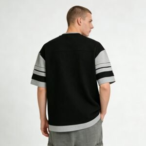 Man wearing a black and grey waffle knit streetwear t-shirt