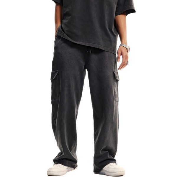 Person wearing washed black patchwork cargo jeans