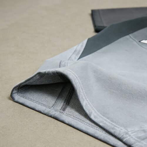 Custom Washed Color-Block Polo Shirt - Style 2FA547 Close-up of a custom washed color-block polo shirt in grey tones.