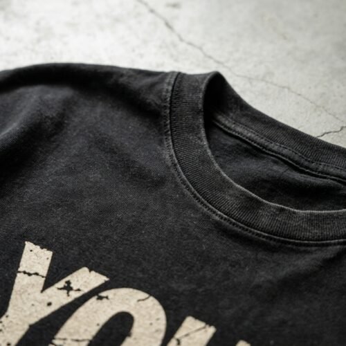 Custom Washed Cropped Graphic T-Shirt - Style 895C25 Close-up of a black washed cropped graphic t-shirt.