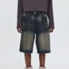 Man wearing vintage washed relaxed fit denim shorts