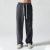 Custom Washed Loose-Fit Denim Sweatpants VW-DJ01 - Style 0A9E5A Man wearing two-tone black and grey distressed denim sweatpants
