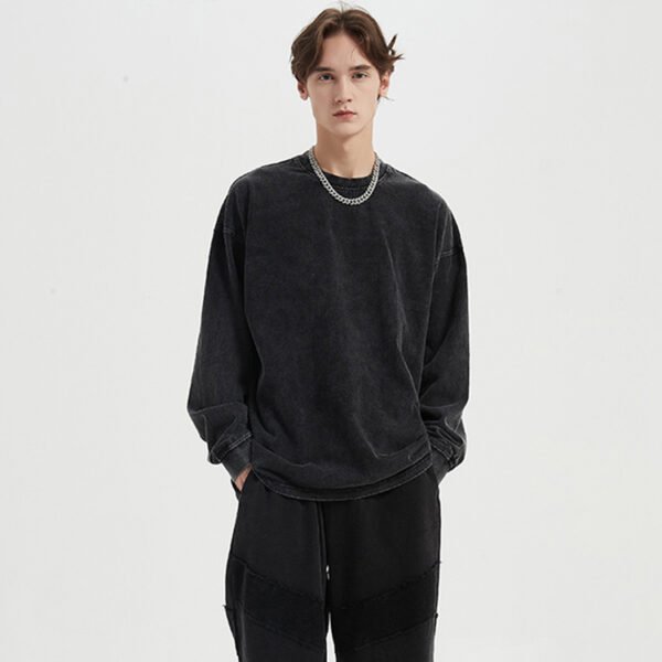 Custom Washed O-Neck Pullover Sweatshirt | 02ffecef05e56a87 - Style 02FFEC Man wearing a black washed-effect oversized crew neck sweatshirt.