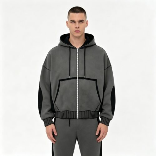 Custom Washed Patchwork Zip Hoodie - Style 931553 Man wearing a grey zip-up hoodie with black accents.