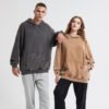 Custom Washed Pullover Hoodie with Elasticated Trims - Style 2C3CB8 Couple wearing washed charcoal and tan oversized pullover hoodies