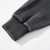 Close-up of a dark gray washed pullover hoodie cuff