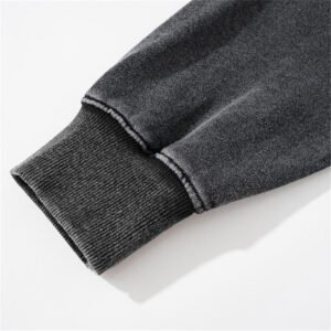 Close-up of a dark gray washed pullover hoodie cuff