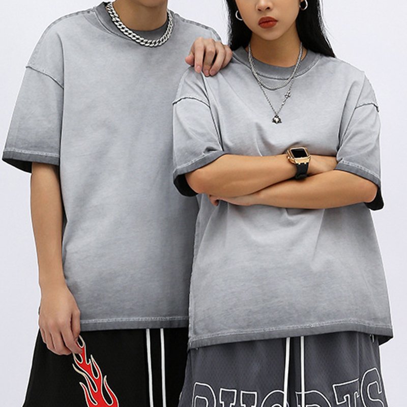 Couple wearing grey washed heavyweight t-shirts with ombre effect.
