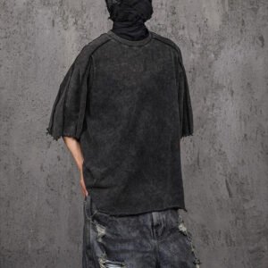 Dark grey washed oversized t-shirt with a distressed vintage look and raw edges.