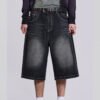 Custom Washed Wide-Leg Denim Shorts - Style E6CF8D Man wearing washed black wide-leg denim shorts