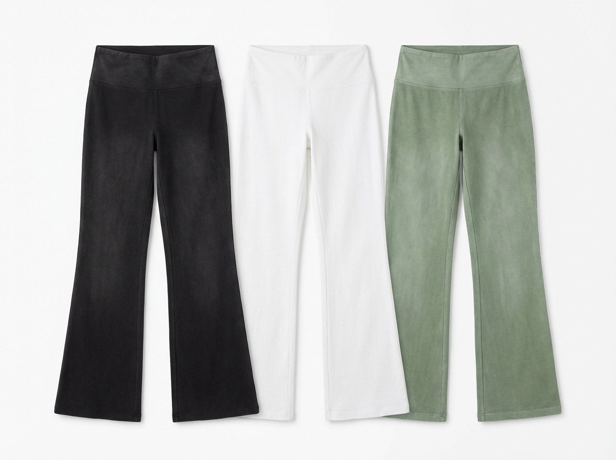 Three pairs of flared yoga pants in black, white, and green
