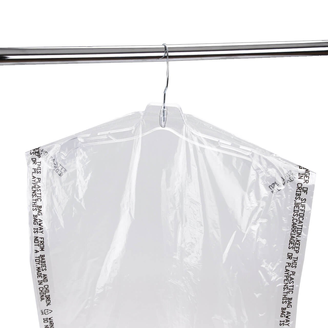 Clear plastic garment bag hanging on a hanger with warnings