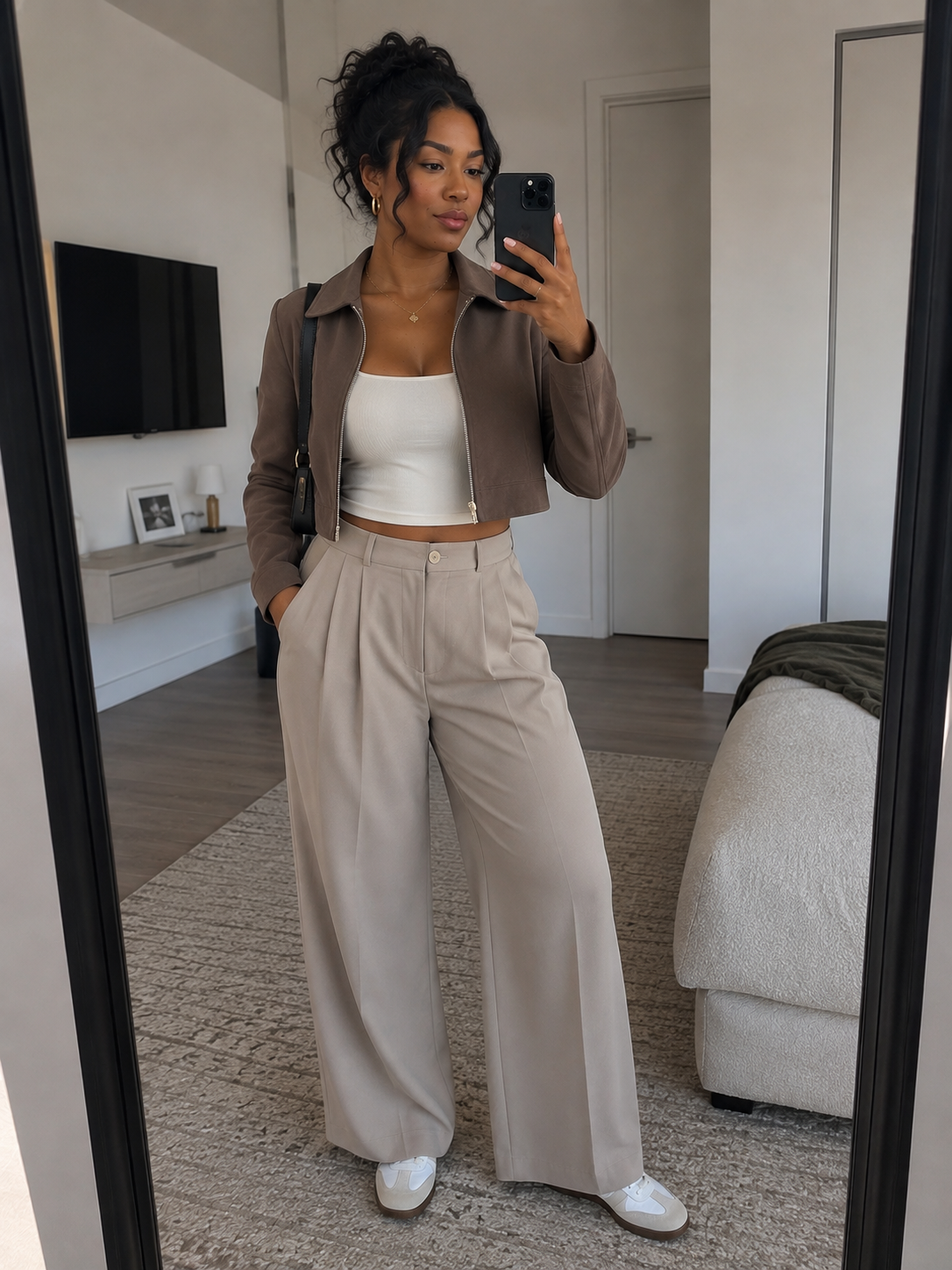 Woman in brown cropped jacket and beige wide-leg pants