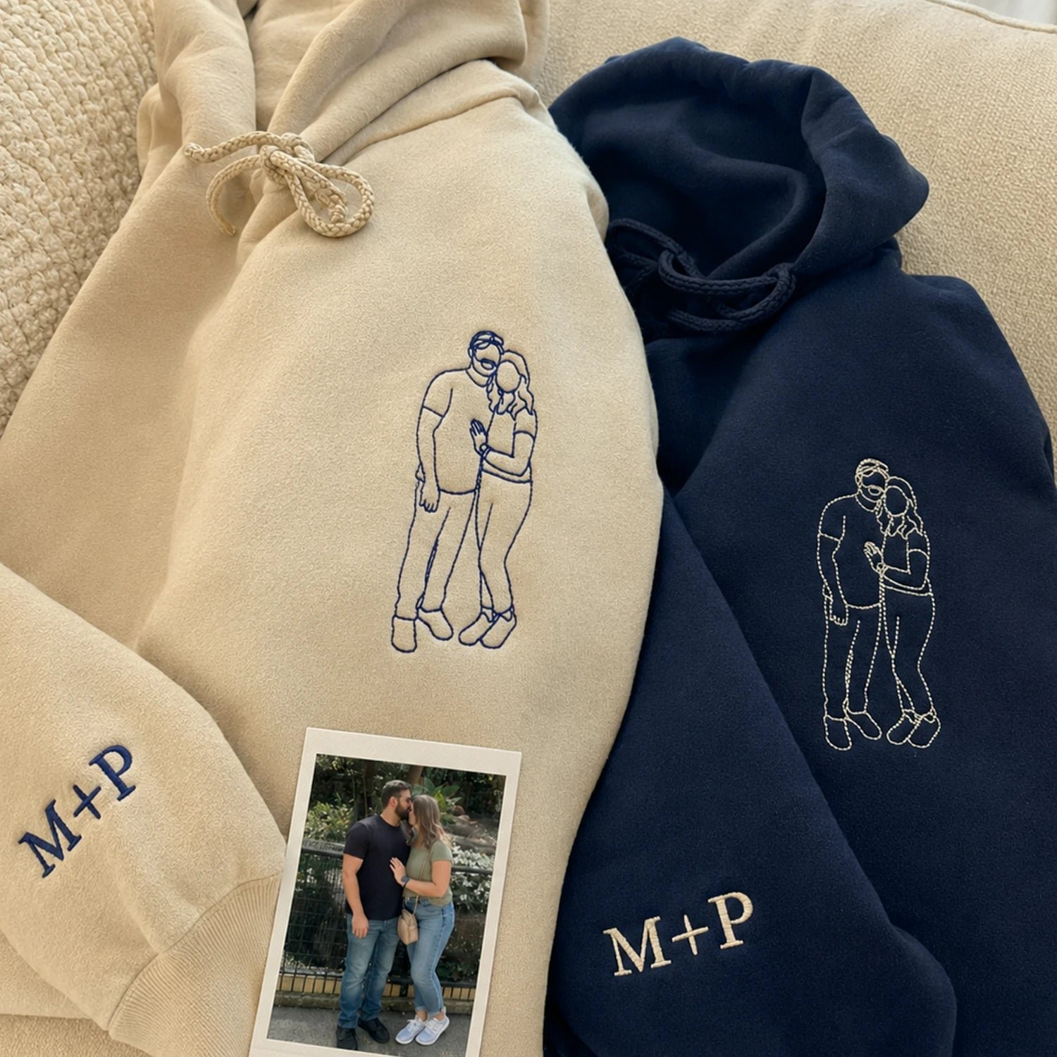 Two custom embroidered hoodies with personalized initials and couple portraits.