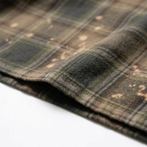 Custom Vintage Plaid Spray-Dyed Embroidered Shirt - Style 56FC14 Close-up of green and brown plaid fabric with spray dye and embroidery