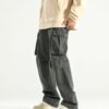 Loose fit vintage-washed cargo pants with multiple utility pockets and adjustable features.
